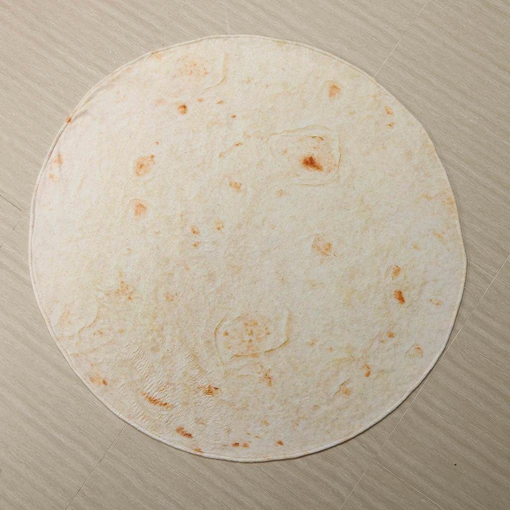 Rund tortillafilt på soffa