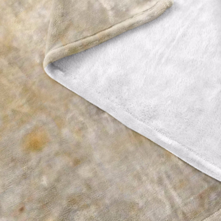 Rund tortillafilt på soffa