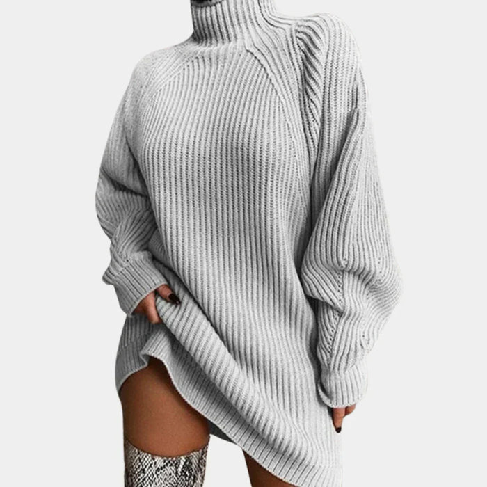 Oversized genser til dame i åpen strikk med ribbestrikkede mansjetter