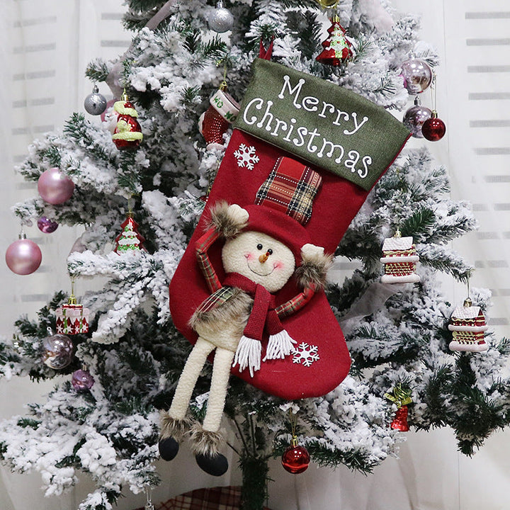 Julstrumpa med tomte och dinglande ben