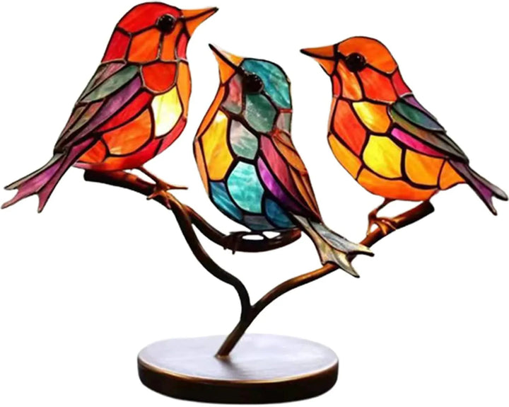 Decorative sculpture with brightly-coloured fugler on branch