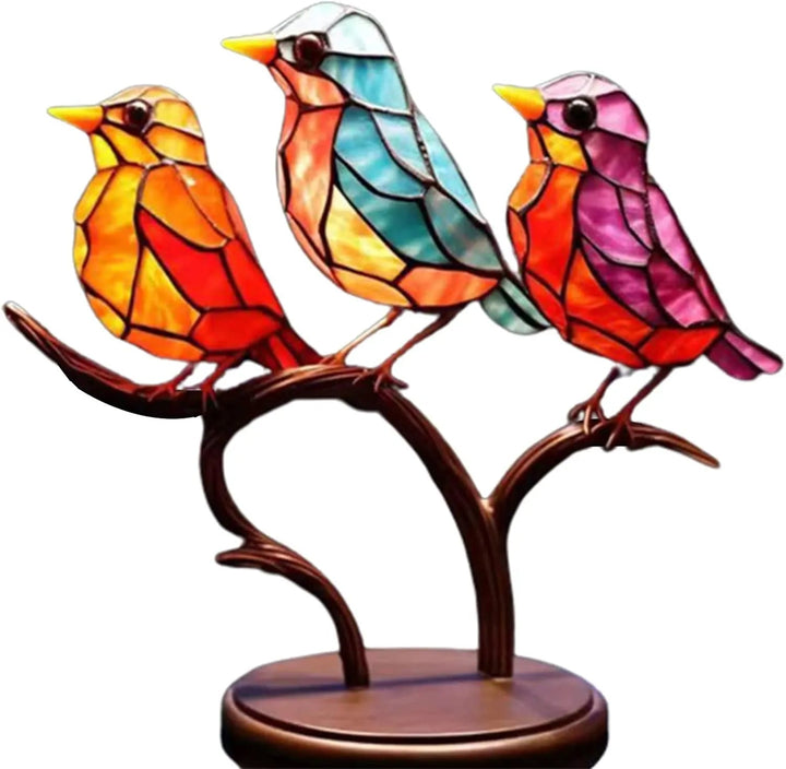 Decorative sculpture with brightly-coloured fugler on branch