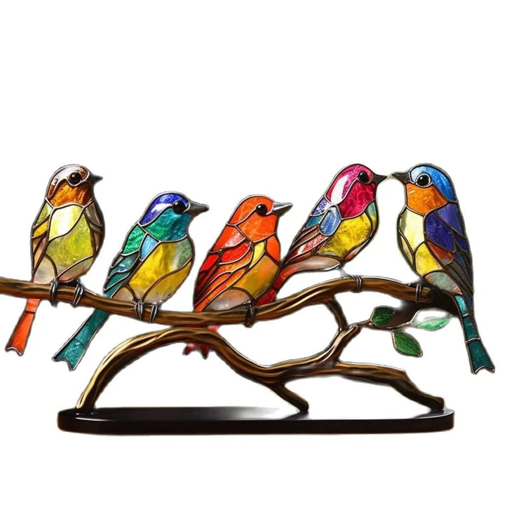 Decorative sculpture with brightly-coloured fugler on branch
