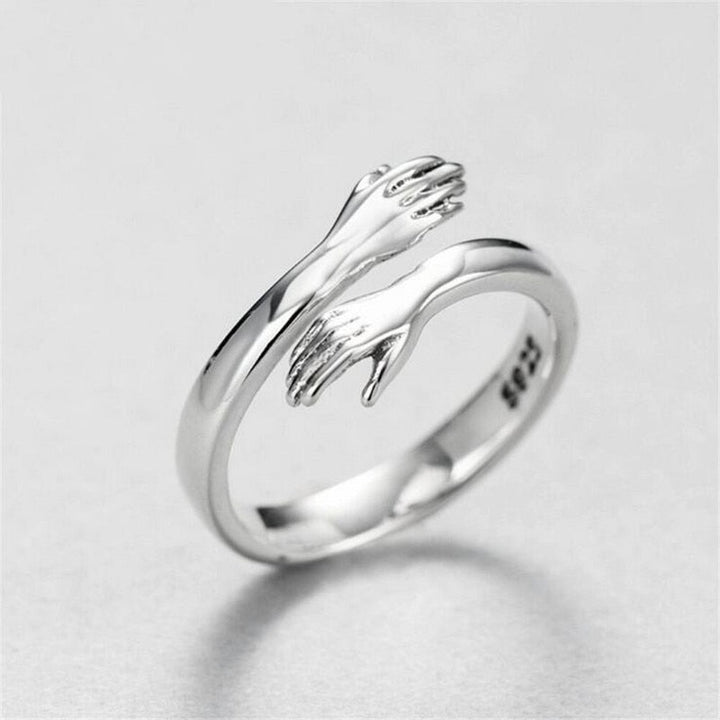 Unisex adjustable hug ring in silver - symbol on love and friendship
