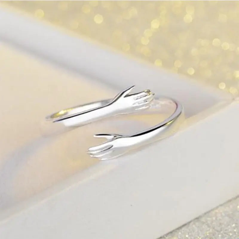 Unisex adjustable hug ring in silver - symbol on love and friendship